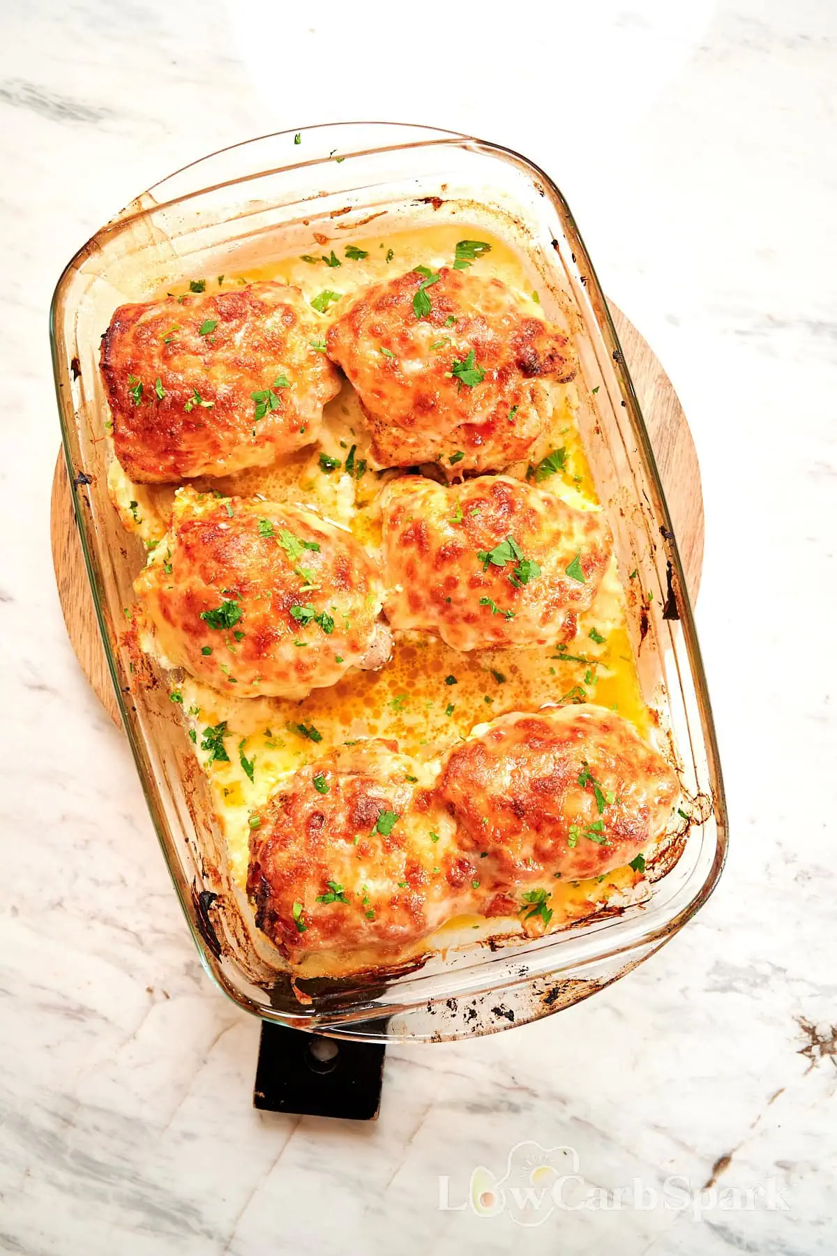 Famous Chicken Breast Rolls 14 Baked chicken breast rolls with golden cheese topping in a glass baking dish