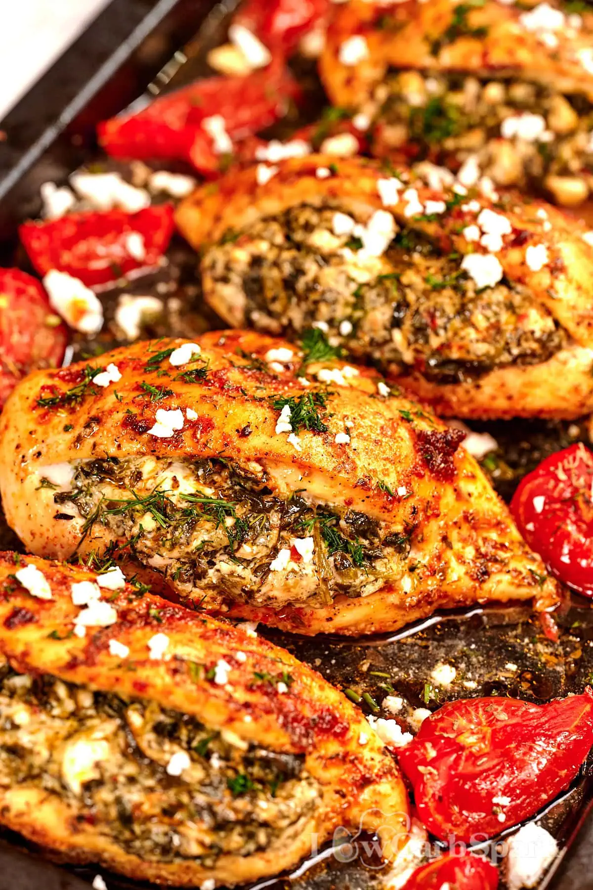 Spinach and Feta Stuffed Chicken Breast 10 Sheet pan spinach and feta stuffed chicken with roasted tomatoes, an easy keto friendly chicken recipe.