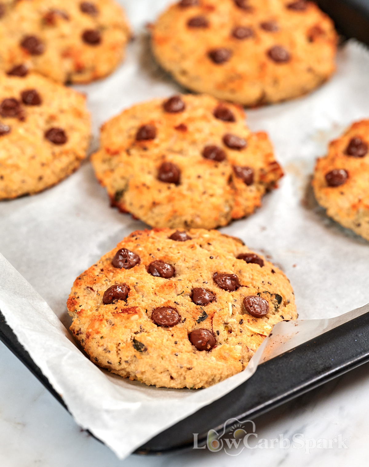 High-Protein Cottage Cheese Breakfast Cookies 4 Close-up of High-Protein Cottage Cheese Breakfast Cookies with melty chocolate chips, golden edges, oats, chia seeds, and crunchy almonds, baked until lightly crisp.