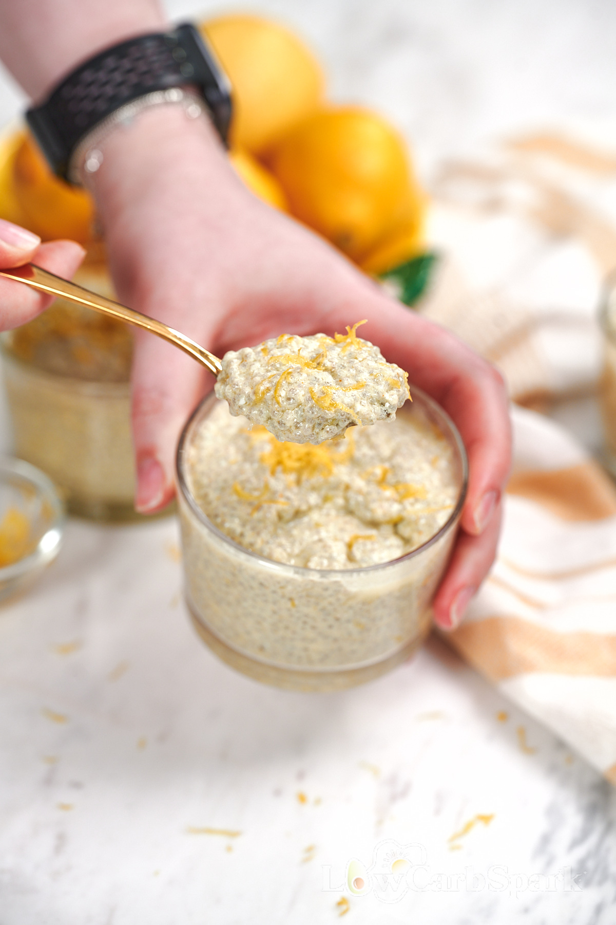 High-Protein Cottage Cheese Lemon Chia Pudding 1 Spoonful of high-protein cottage cheese lemon chia pudding topped with fresh lemon zest, showing its thick and creamy texture.