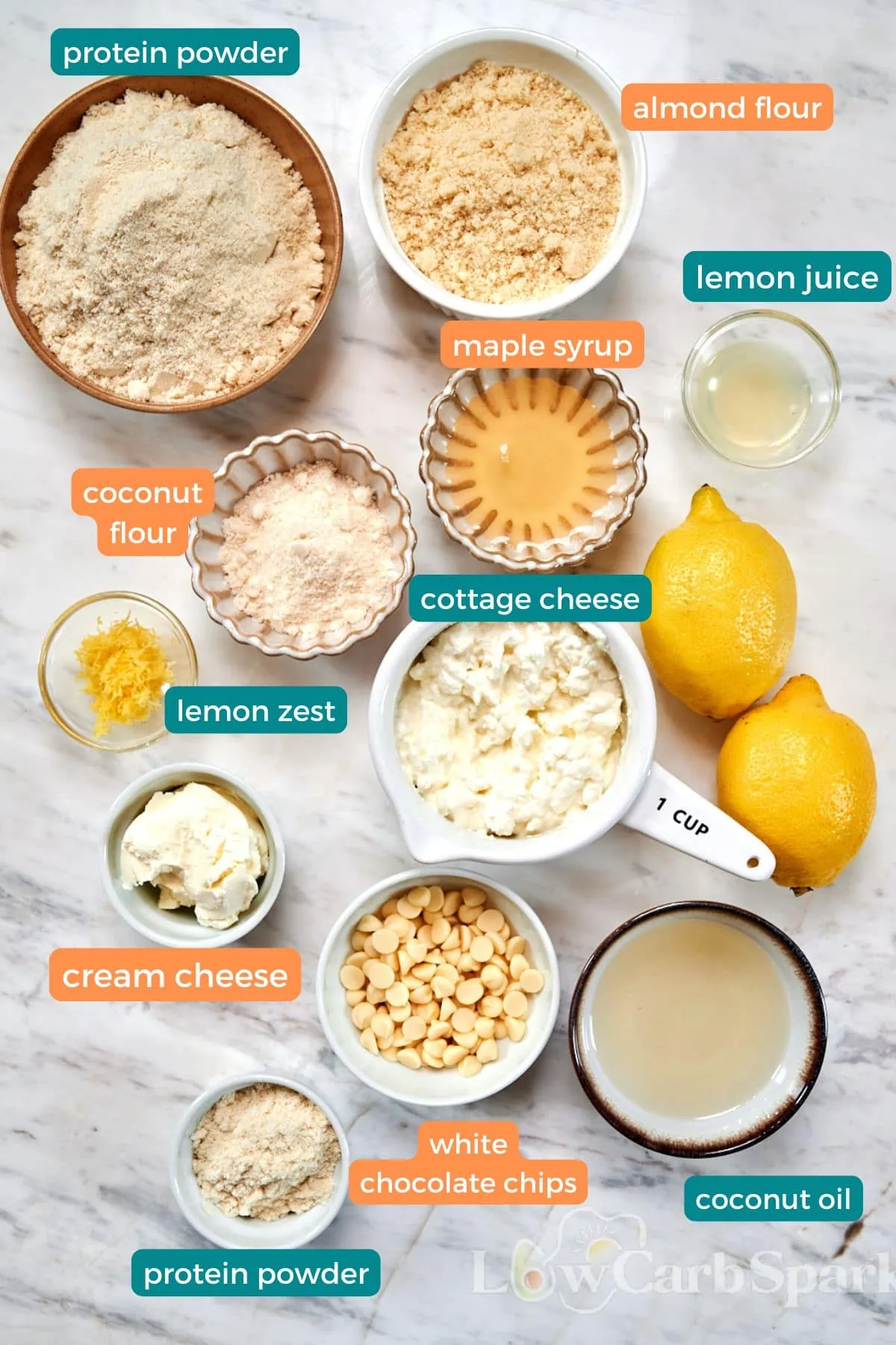 Lemon Cottage Cheese Protein Bars 3 Ingredients for lemon cottage cheese protein bars including cottage cheese, protein powder, almond flour, coconut flour, cream cheese, lemon, and white chocolate chips.