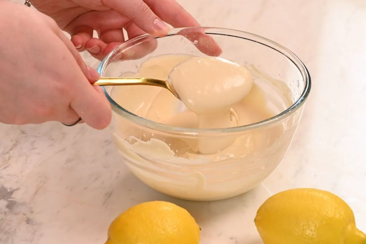 Lemon Cottage Cheese Protein Bars 10 Creamy lemon frosting ready to spread over homemade cottage cheese protein bars.