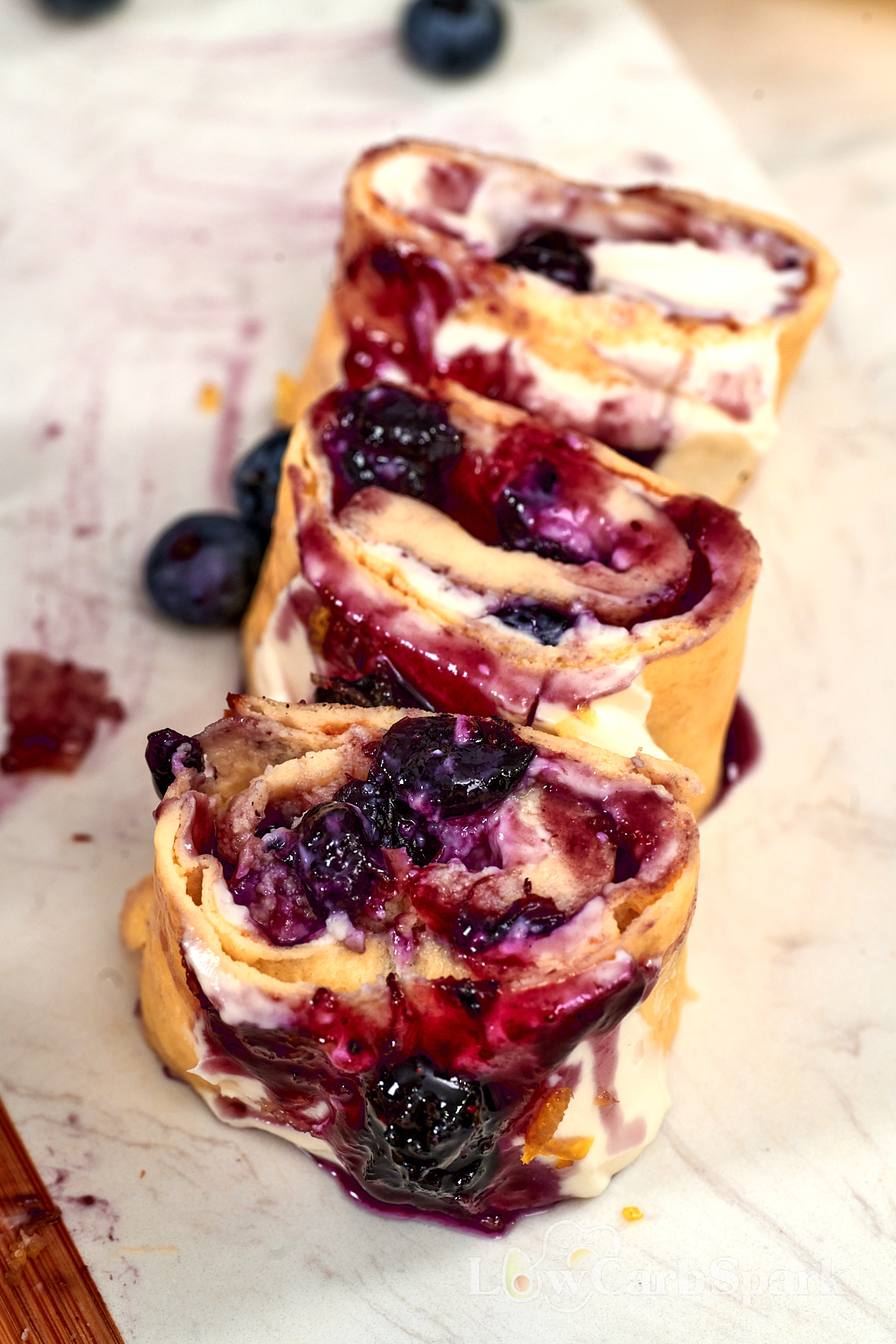 Cottage Cheese Blueberry Roll 13 Sliced high protein cottage cheese blueberry roll filled with creamy cheese and juicy blueberry filling.