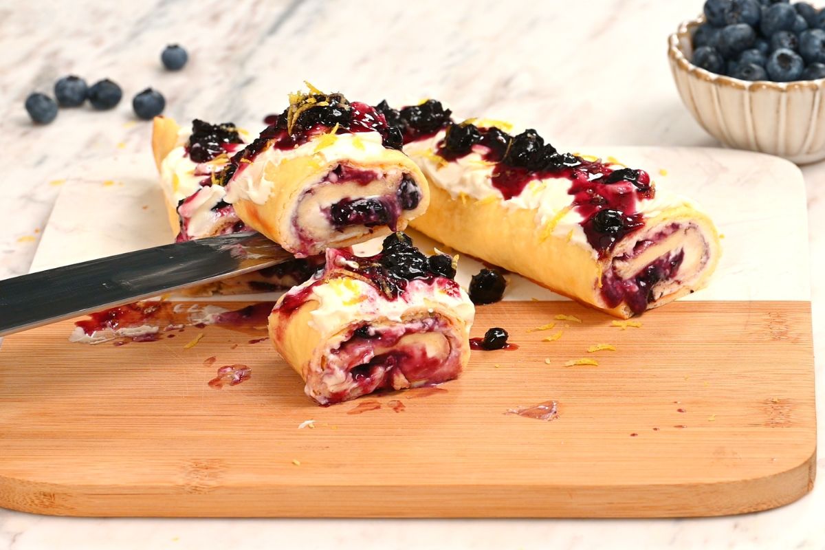 Cottage Cheese Blueberry Roll 12 Sliced high protein cottage cheese blueberry roll showing the creamy filling and blueberry swirl inside.