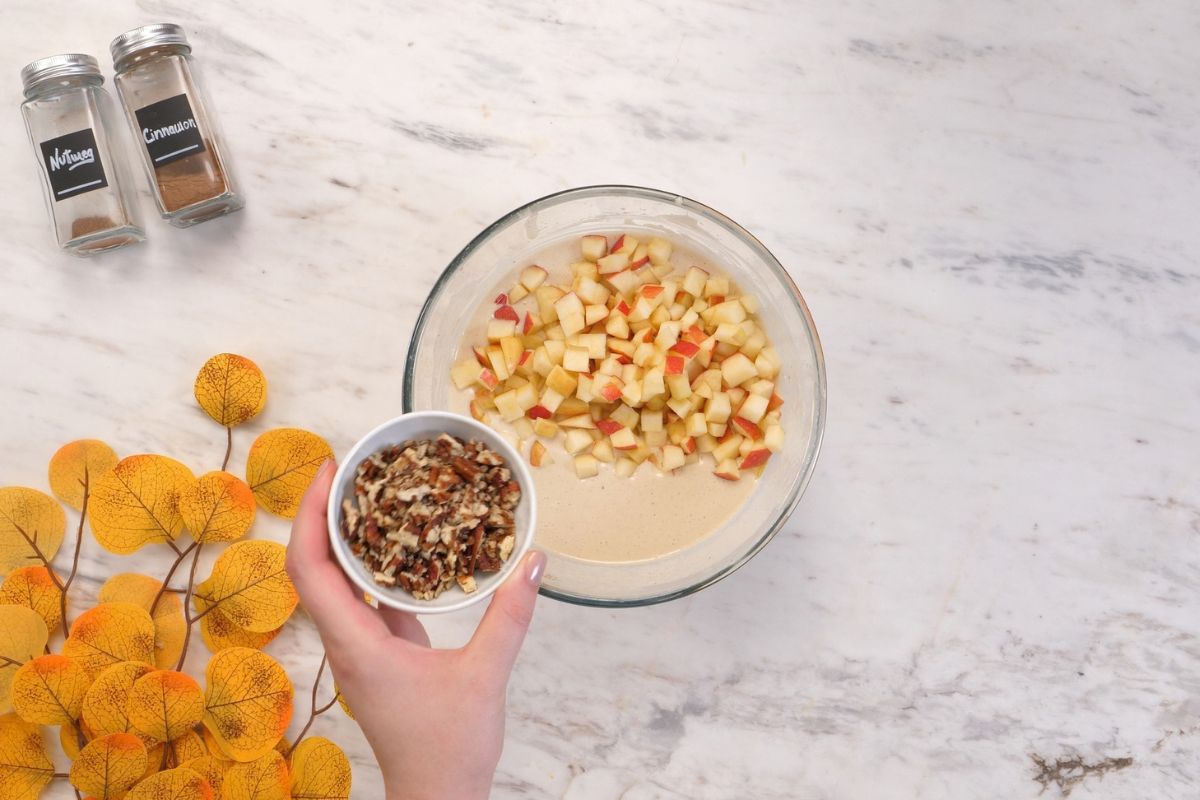 Cottage Cheese Apple Bake 7 Diced apples and chopped pecans being added to the blended cottage cheese apple batter.