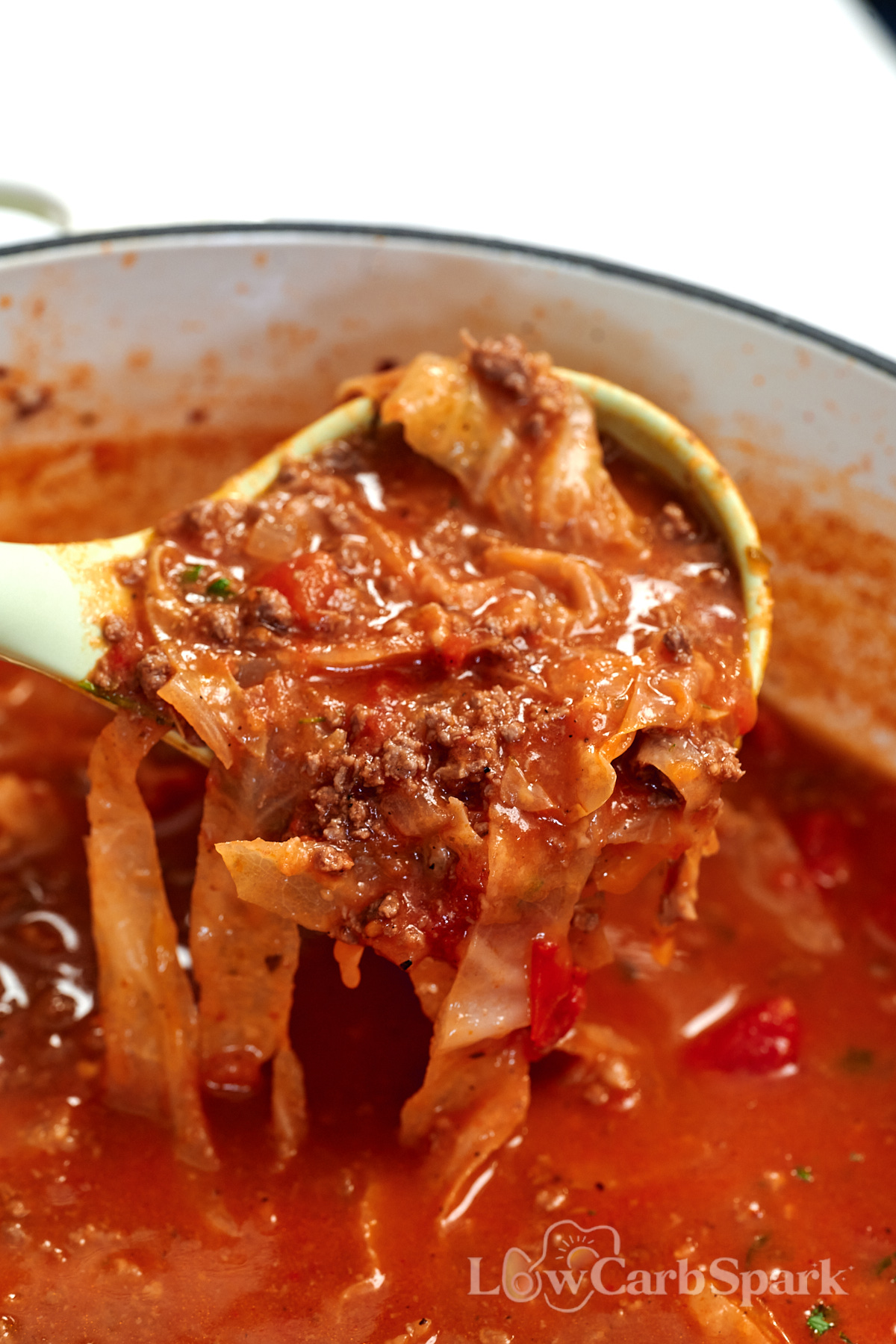 High-Protein Cabbage Lasagna Soup 13 Close-up of High-Protein Cabbage Lasagna Soup with ground beef, tender cabbage, and rich tomato broth in a ladle.