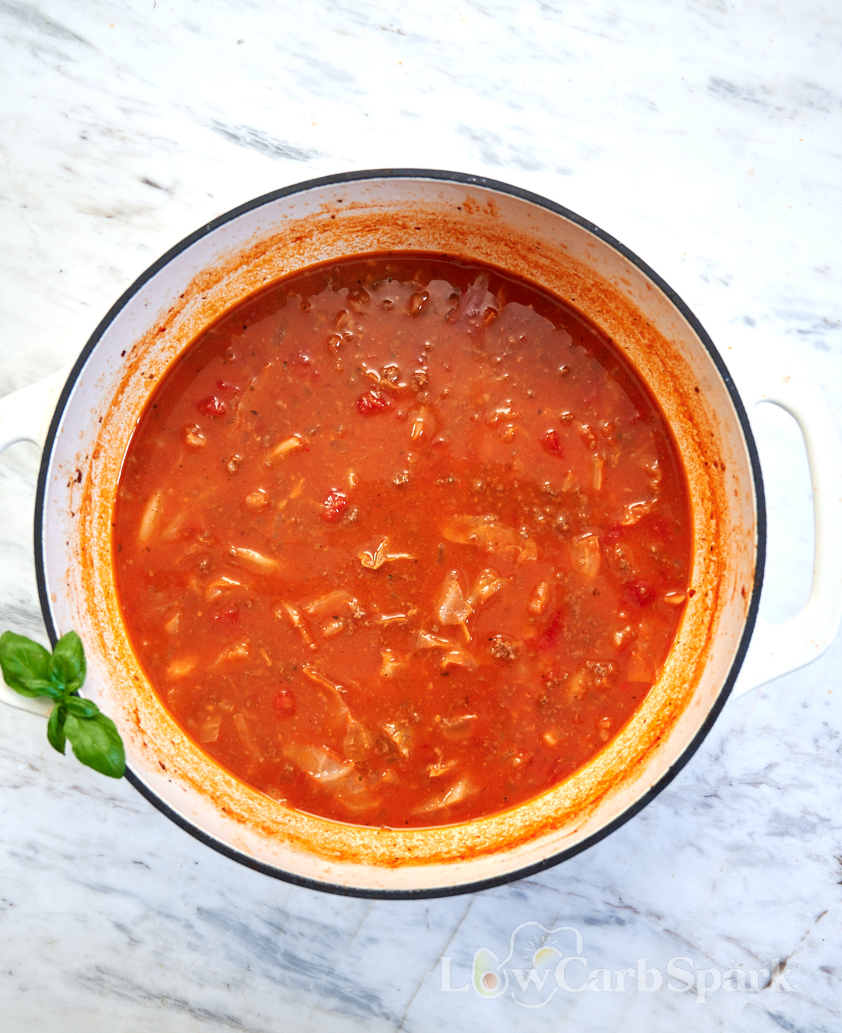 High-Protein Cabbage Lasagna Soup 4 High-Protein Cabbage Lasagna Soup simmering in a large pot with ground beef, cabbage, and tomatoes.