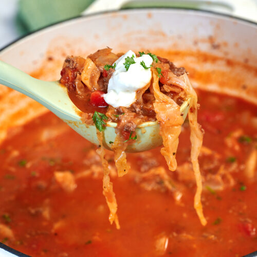 High-Protein Cabbage Lasagna Soup 15 Ladle of cabbage lasagna soup with ground beef, tender cabbage, cottage cheese, and fresh parsley.
