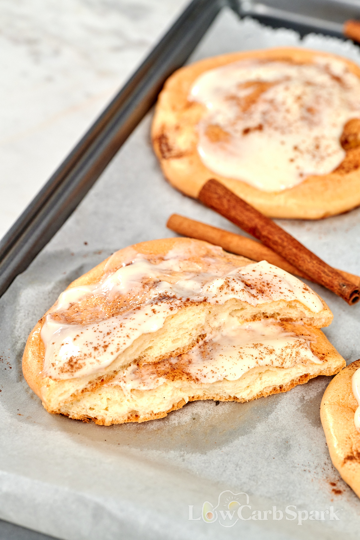 Cloud Cinnamon Rolls with Cottage Cheese 14 Cloud cinnamon roll cut open to show the soft, fluffy cottage cheese texture with cinnamon swirl and frosting.